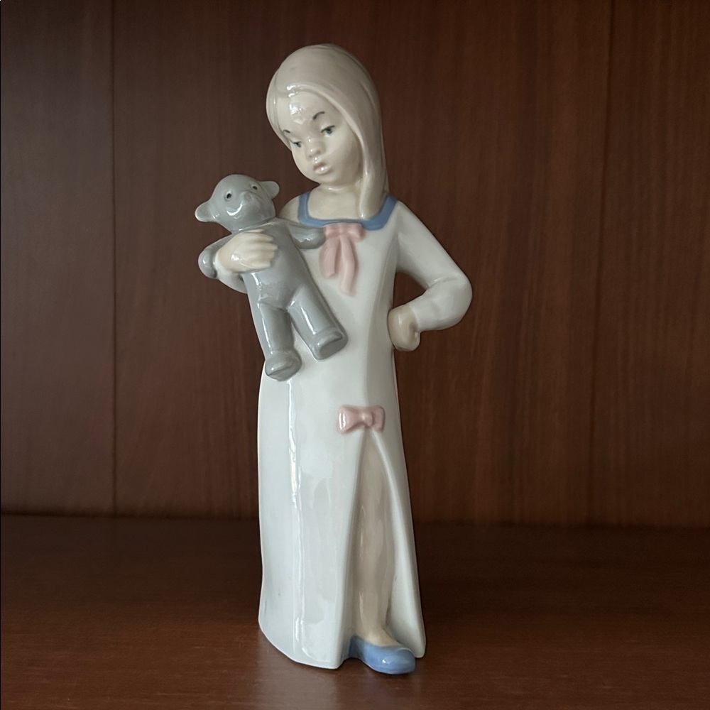 Porcelain Girl Figurine with Toy